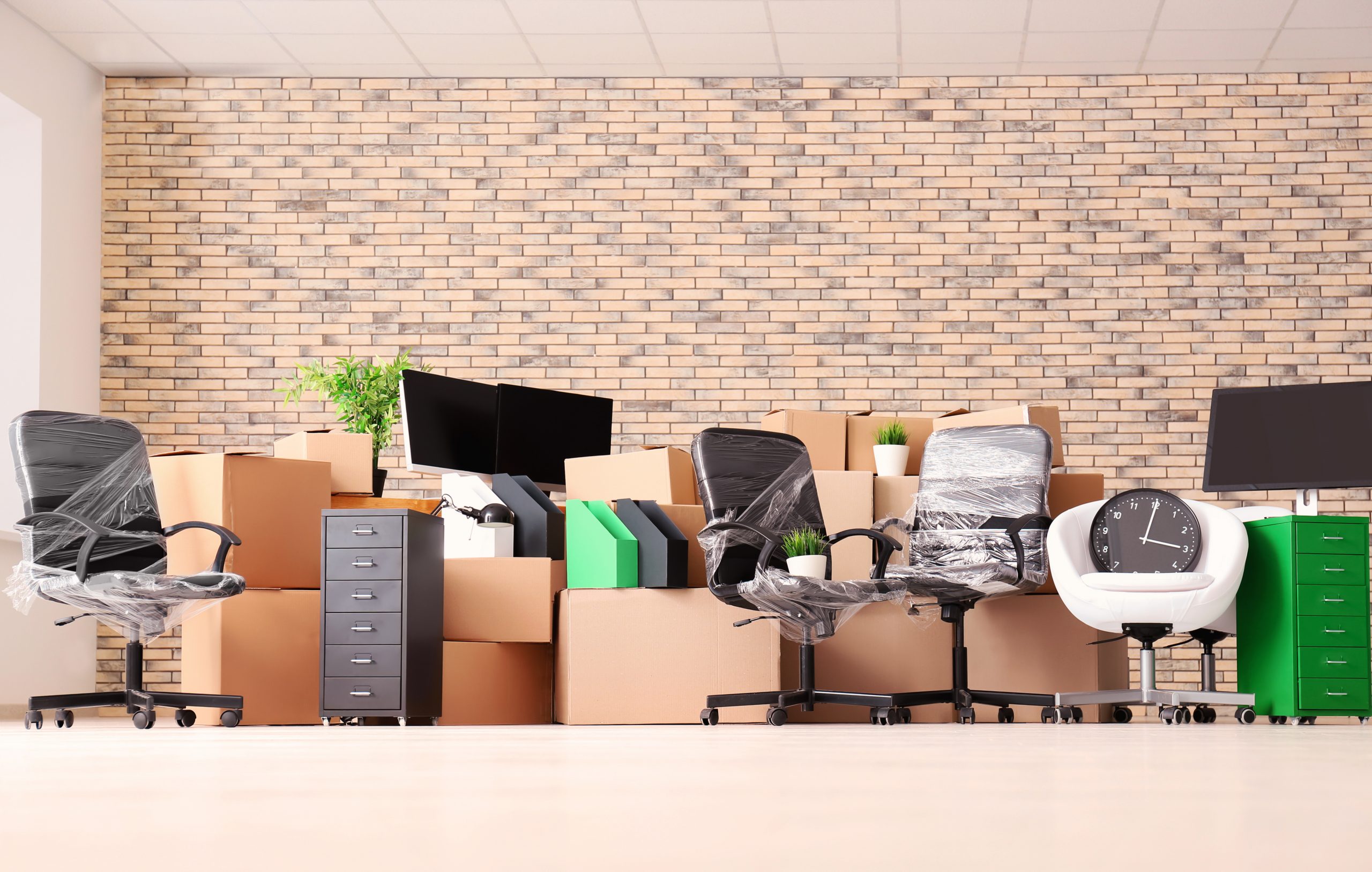 Carton boxes with stuff in empty room. Office move concept