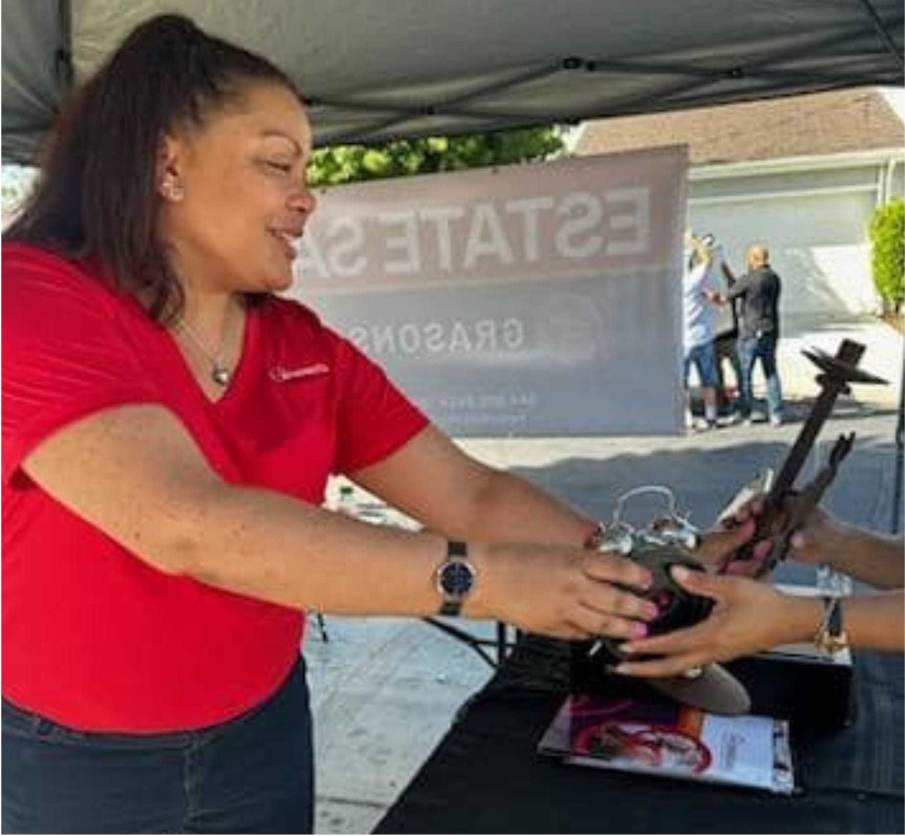 Picture of Lisa Johnson, owner of Grasons of Frisco, TX at the cash register.