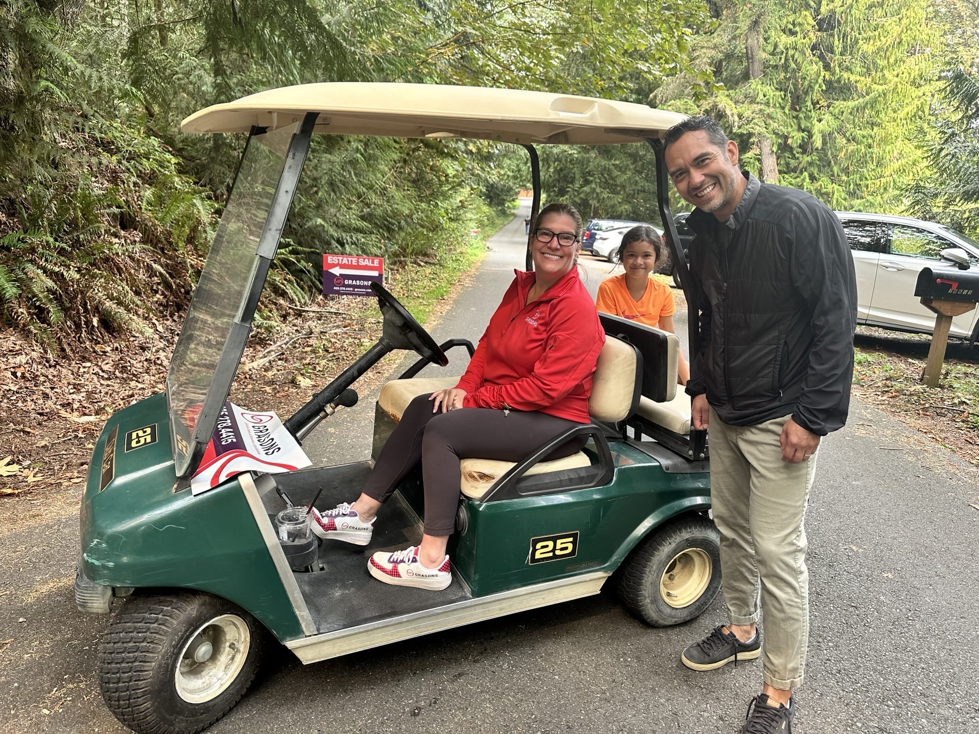 Victoria on a golf cart transporting guests to the estate sale.