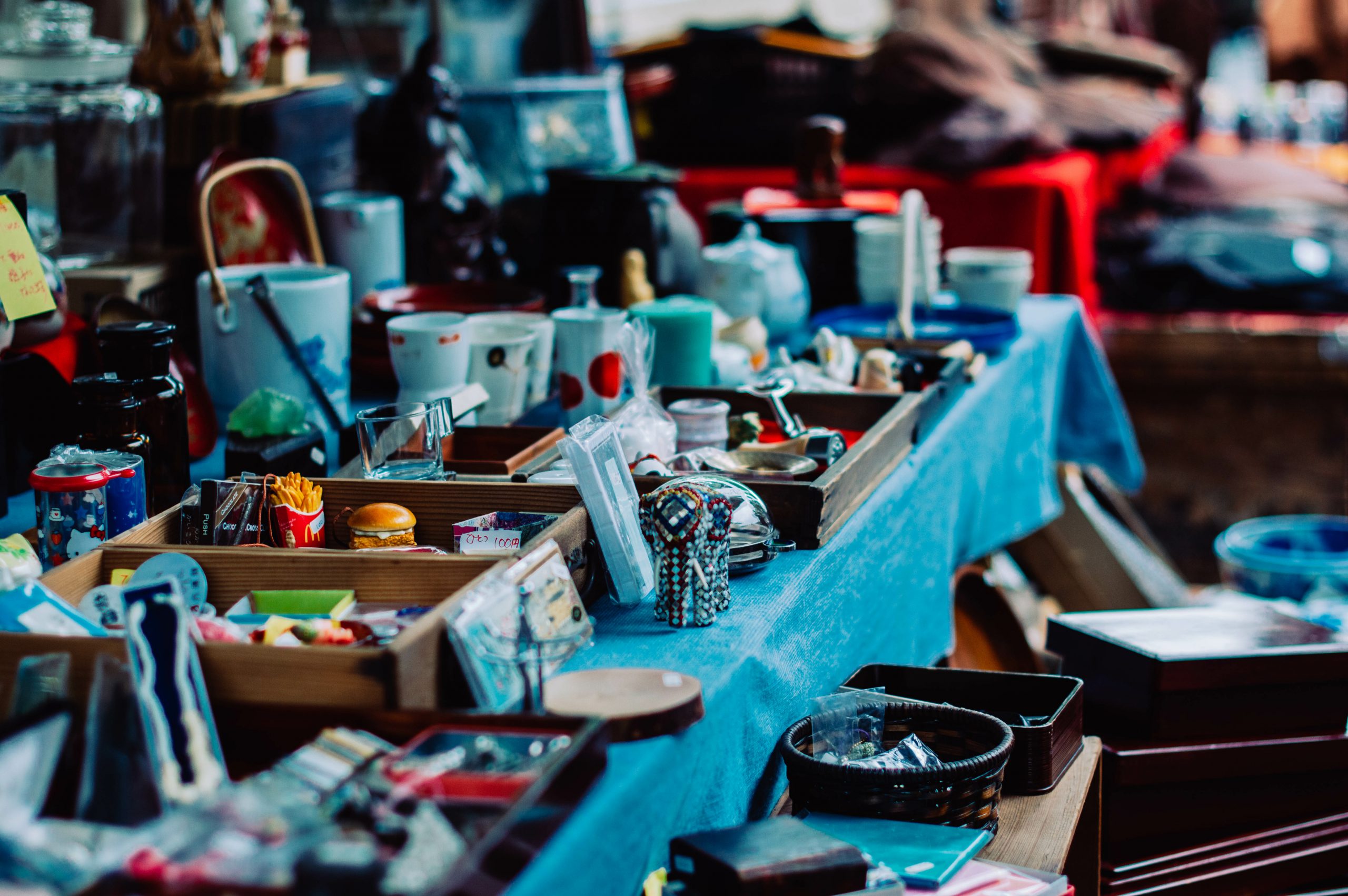 Photo of a table laid out with the items of an estate sale