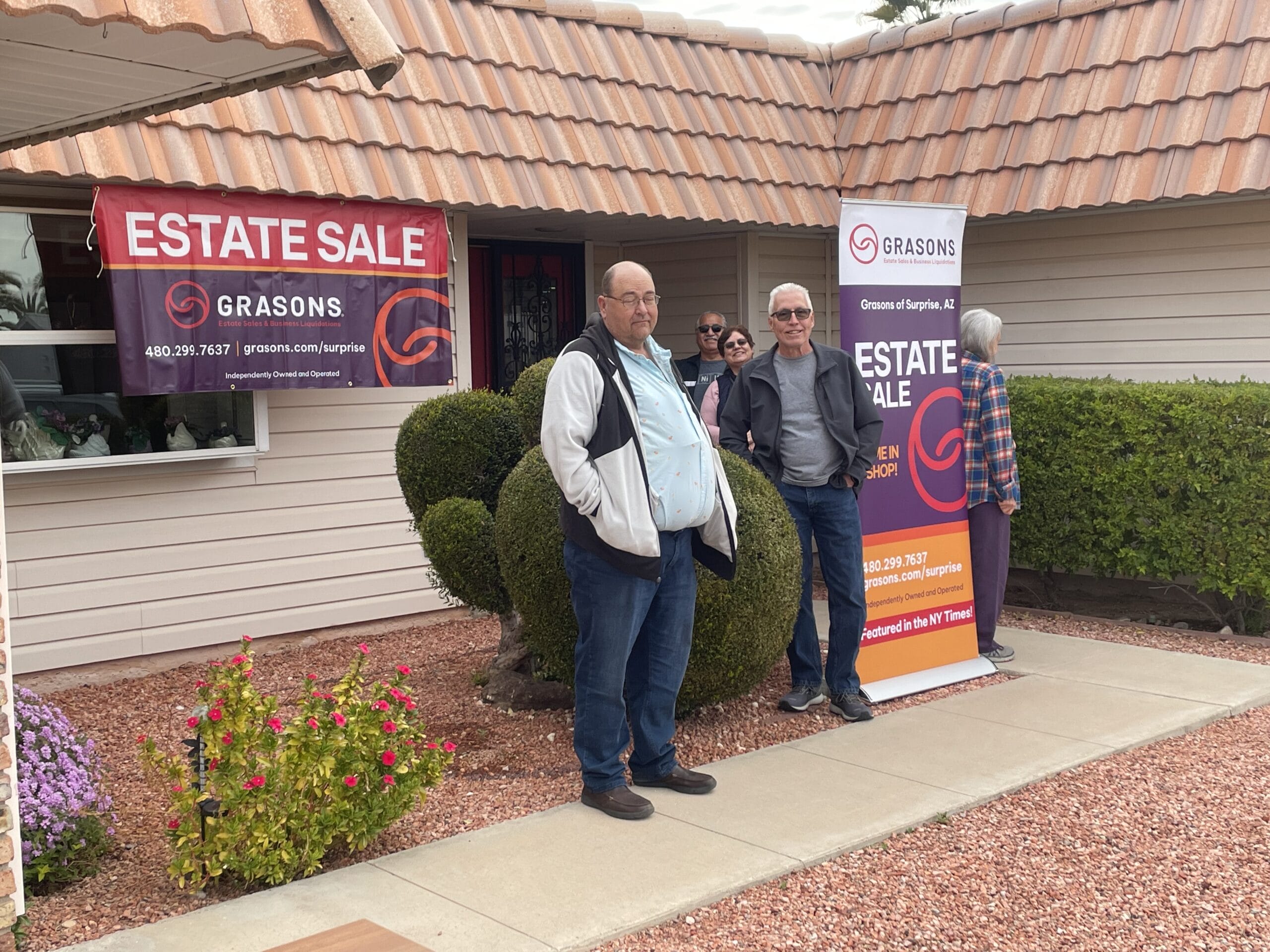 People waiting in line for an estate sale at Grasons of Surprise.